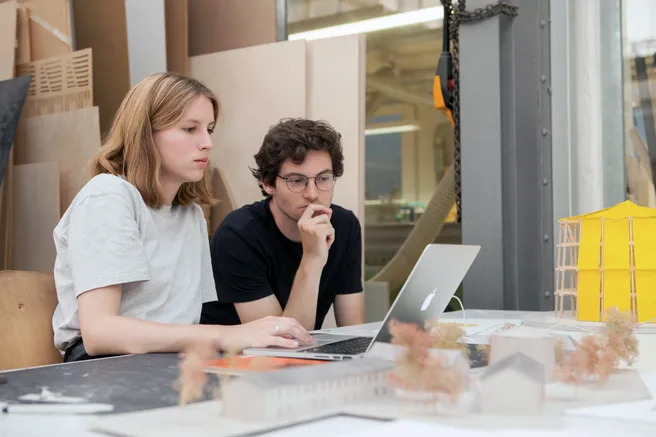 Students focussed on laptop